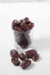 Dried dates fruits on white background, tasted sweet and chewy