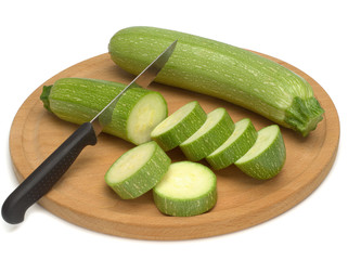 Squash, vegetables marrows, zucchini with a knife on a wooden board isolated on white background