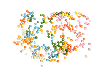 Assorted bean candies on white background, unorganised, chaos.