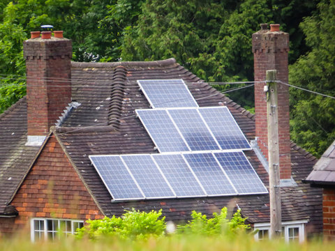 Solar Panels On Roof Of Rural House 