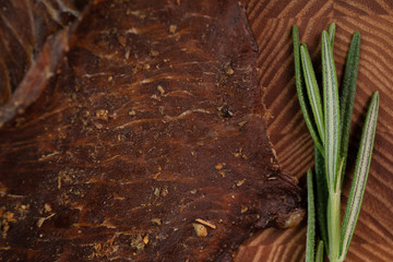 Close-up of a piece of meat on a wooden Board with spices. Restaurant menu, a series of photos of different dishes