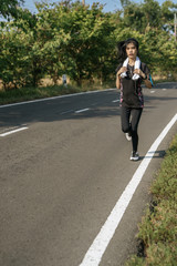 women exercise by running on the road.