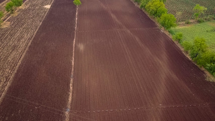 aerial view of a plowed field ready for sowing