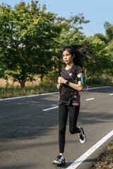 women exercise by running on the road.