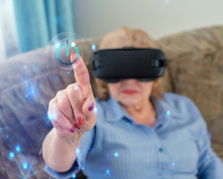 Amazed Senior Woman Enjoying Cyber World, Using VR Glasses At Home. New Trends And Technology Concept And Funny Active Elderly