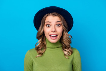 Closeup photo of cheerful wavy lady good mood open mouth listen unbelievable unexpected good news wear hat casual green turtleneck isolated blue color background