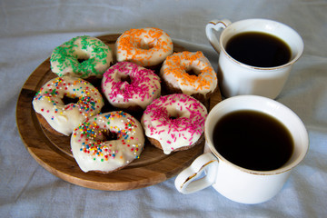 Sweet Donuts And Two Cups Of Coffee