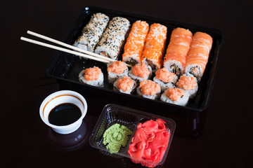 Set with an assortment of fresh Japanese rolls with fish. Roll with rice and sesjut. Food in comfortable packaging