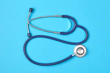 Stethoscope on blue background. Medical background. Doctor equipment. Copy space