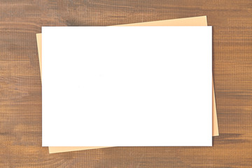 Blank of brochure is on a wooden desk. Template for your design.