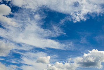 White clouds against a blue sky.