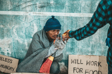 The bread-makers gave to the beggars who sat on the side of the road.