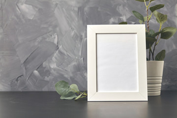 Photo frame on wood table. On gray background with copy space