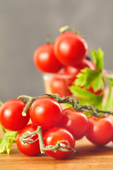 Fresh cherry tomatoes on a wooden table. Selective focus