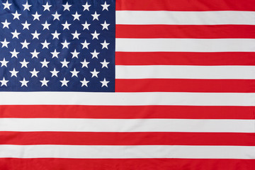 Close up of ruffled American flag. Satin texture curved flag of USA. Memorial Day or 4th of July. Banner, freedom concept