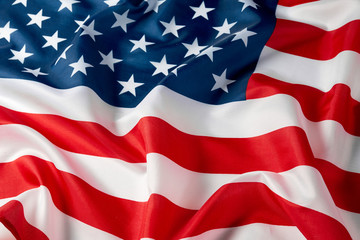 Close up of ruffled American flag. Satin texture curved flag of USA. Memorial Day or 4th of July....