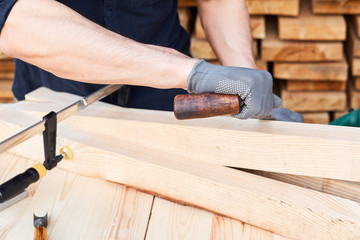 Coronavirus or COVID-19 pandemic stay at home, hobby and passing time concept. Carpenter or man working with wood plane