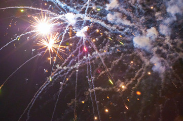 Colourful fireworks on the black sky background. Holiday art background. Long exposure