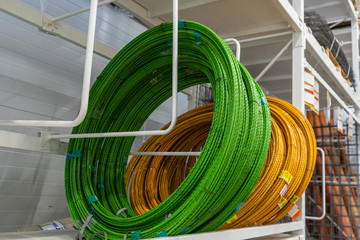 Composite Rebars, green and yellow. Rebar in rolls. Fiberglass reinforcement.