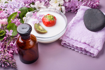 Lilac composition for spas and Wellness centers. Towel frames and flowers.