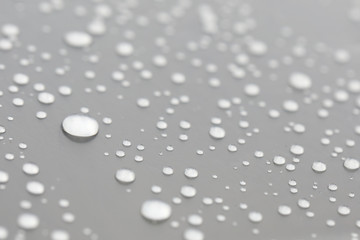 Background design made of water drops on a gray background	
