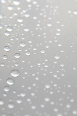 Background design made of water drops on a gray background	