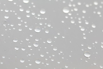 Background design made of water drops on a gray background	