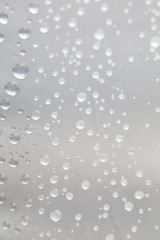 Background design made of water drops on a gray background	