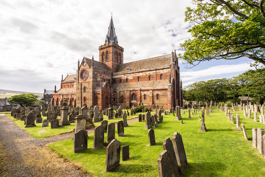 St Magnus Cathedral and surrounding gothic graveyard in Kirkwall, Orkney Islands, Scotland. The holy red sandstone architecture is part of the church of Scotland
