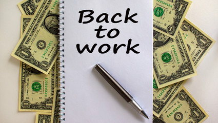 White note with inscription 'back to work' on beautiful background from dollar bills and metalic...