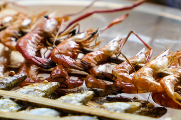 typical Vietnamese food and regional healthy dishes with baked crawfish, small fish, crabs