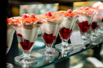 cakes and cakes on the counter in the confectionery store
