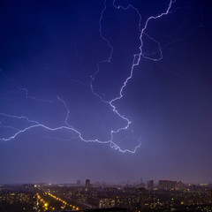 Lightning strikes in the night sky over the night town 2