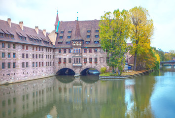 Fototapeta na wymiar Nuremberg Heilig Geist Spital at Pegnitz River 