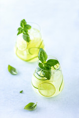Cucumber and basil gin and tonic cocktail in glasses