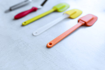Set of multi-colored silicone spatulas, kitchen tools. Sweet pastries, recipes, cooking