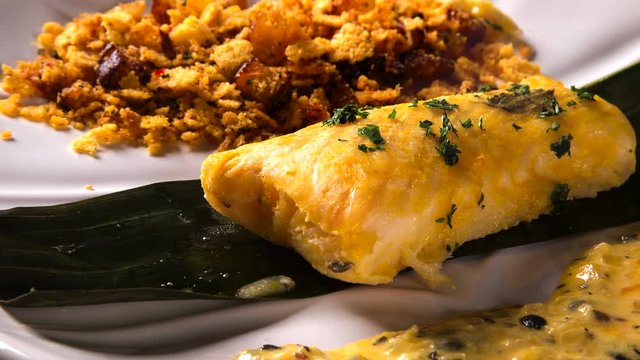 Fried fish with farofa and passion fruit sauce - Traditional amazonian dish - Filhote caboclo