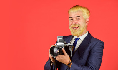 Classy and old school. Manual settings. Photographer with blond beard and mustache. Content creator. Man bearded hipster photographer. Photographer hold retro camera. Connoisseur of vintage values