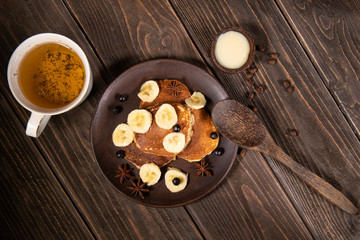 Yummy pancakes on wooden background