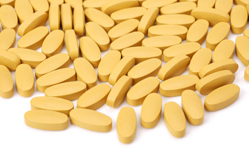 Fototapeta na wymiar vitamin C tablets on white background