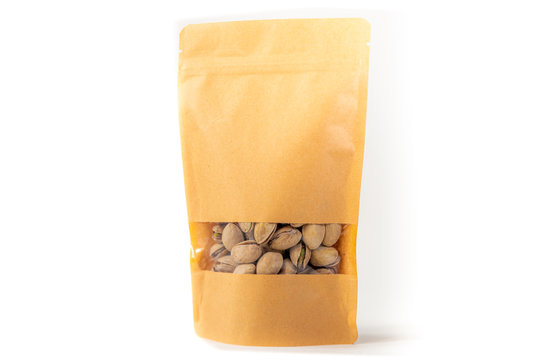 kraft paper doypack pouch flexible packaging with window zipper on white background filled with pistachios