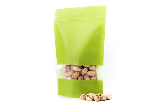 filled green paper biodegradable doy pack flexible packaging with window and zipper on white background