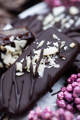 Macro photo of chocolate candy without sugar. Raw vegan chocolate candies. Lactose free candies. Gluten free candies. Without artificial dyes chocolate.