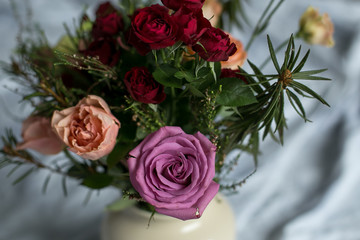 Bouquet with different flowers  in the vase at the home. Amazing smell from the flowers.