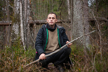 Portrait of a guy in the shade of plants.