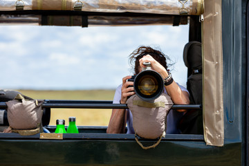 Professional female photographer on safari © Rixie