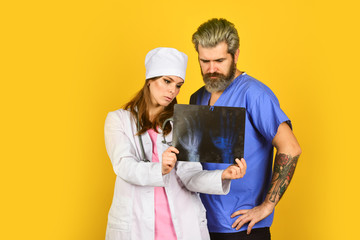 radiographs tomography result. doctor and nurse need expert advice. study patient medical record. make a diagnosis. doctor on duty discuss diagnose. consultation. x-ray diagnostics