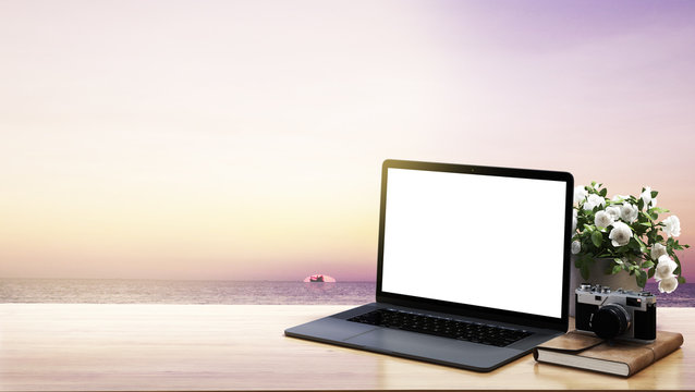 Work from home space and workplace for bussiness and notebook computer and mobile phone and sea vew and sunset background © teeraphan