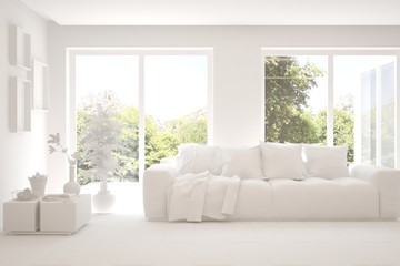 White living room with sofa and summer landscape in window. Scandinavian interior design. 3D illustration