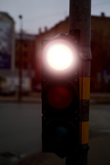 Traffic light red on a city street.
